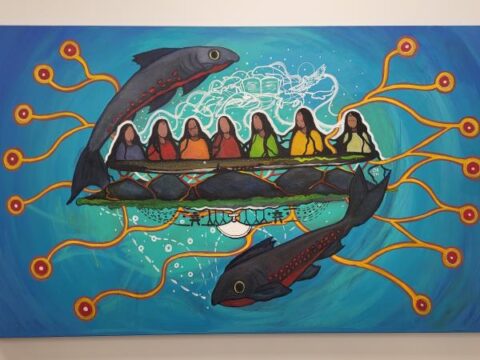 Painting in bright colours of 7 figures in a canoe, a fish leaping over their heads, and a mirror image of the fish swimming beneath.